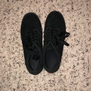All black low top vans